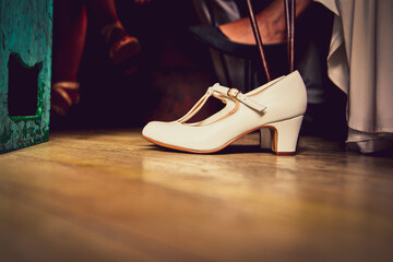 Naklejka premium white bridal shoes on the floor