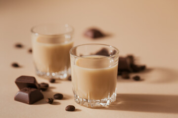 Short glasses of Irish cream Liquor or Coffee Liqueur with chocolat and coffee beans
