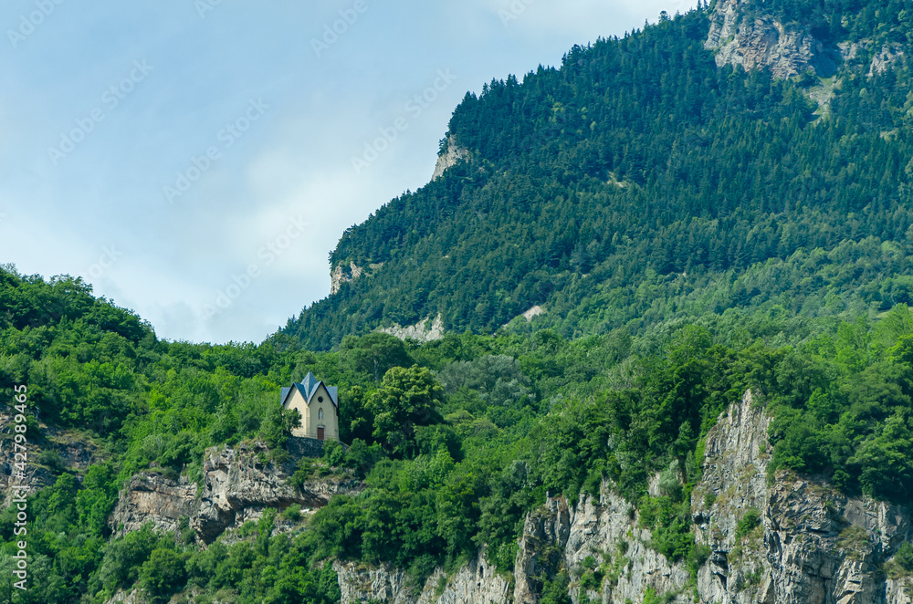 Wall mural church in the middle of the mountains, beautiful landscape. north of italy