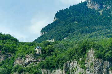 Fototapeta premium Church in the middle of the mountains, beautiful landscape. North of Italy 