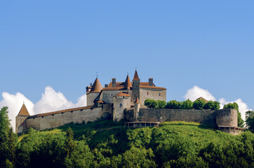 External view of the village of Gruyeres, famous cheese making town of switzerland, with its medieval castle at the top of the hills