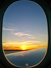 looking at the sunset from a plane window