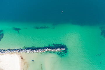 Breakwater and shipping canal at the entrance to Yuzhny port. Helicopter view.