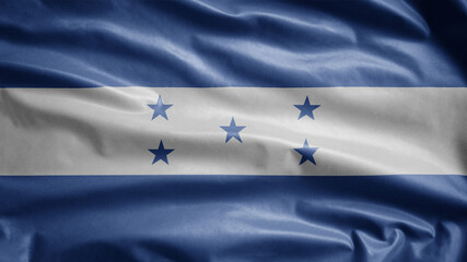 Honduran flag waving in the wind. Close up of Honduras banner blowing soft silk.