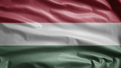 Hungarian flag waving in the wind. Close up of Hungary banner blowing soft silk.