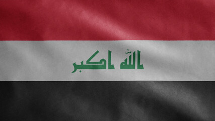 Iraqi flag waving in the wind. Close up of Iraq banner blowing soft silk.
