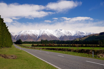 mountain chain in new zealand seen from the roadside