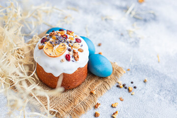 Easter cake panettone and Easter eggs festive table setting traditional treat. Happy easter holiday on the table meal snack top view copy space  food background rustic