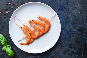 shrimp on skewer prawns kebabs seafood snack trend meal pescetarian diet vegetarian food copy space food background rustic. top view 