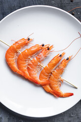 shrimp on skewer prawns kebabs seafood snack trend meal pescetarian diet vegetarian food copy space food background rustic. top view 