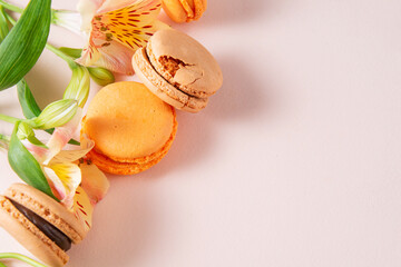 macaroons, beige, peach,  French cookies with flowers on a beige