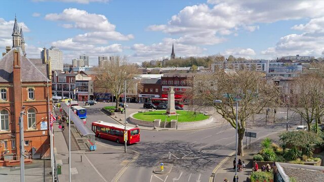 Lots of buses in the city center take people. Time lapse shot from above. Heavy traffic in downtown Walsall. April 15, UK 2021