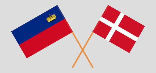 Crossed flags of Liechtenstein and Denmark. Official colors. Correct proportion