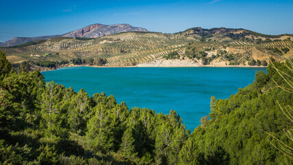 Fototapeta na wymiar View on the turquoise water of the Guadalhorce and Guadalteba Reservoirs, two artificial lakes in the andalusian backcountry in Spain