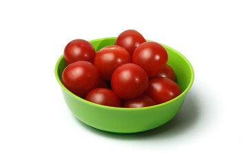 green plastic bowl of tomatoes
