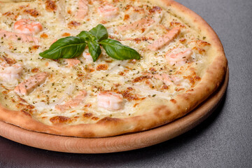 Delicious fresh seafood oven pizza: red fish and shrimp