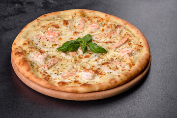 Delicious fresh seafood oven pizza: red fish and shrimp
