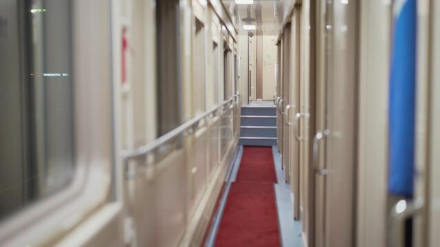 Corridor in the sleeping car of train. Rail travel. Corridor of the compartment car of the train. The compartment carriage of the train.