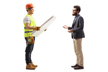 Full length profile shot of a builder with a blueprint talking to a bearded man