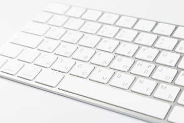 Aluminum keyboard of a modern computer close up. isolated on white background.