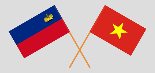 Crossed flags of Liechtenstein and Vietnam. Official colors. Correct proportion