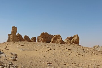 Fototapeta na wymiar The walls and ruins of Dimeh el Sibaa (Soknopaiou Nesos) in Fayoum city desert in Egypt