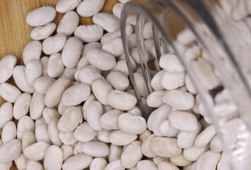 organic dried white beans on a background
