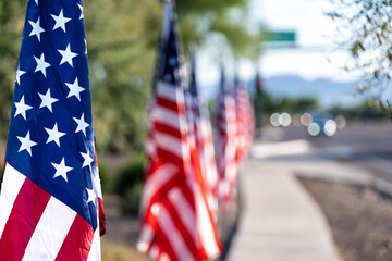 Row of US flags on a city street