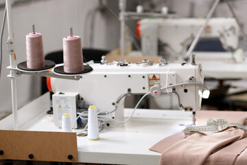 sewing machine with thread skees at the factory