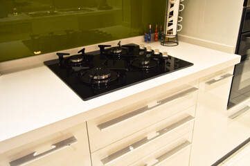 Modern clean kitchen and glass ceramic built-in gas oven