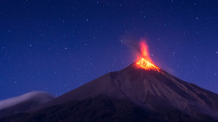 Erupting Fuego volcano in the night; Guatemala Volcano - obrazy, fototapety, plakaty