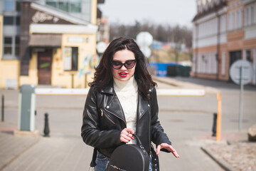 lifestyle fashion portrait of young stylish hipster woman