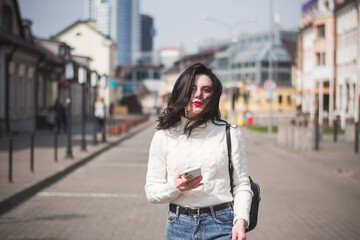 lifestyle fashion portrait of young stylish hipster woman