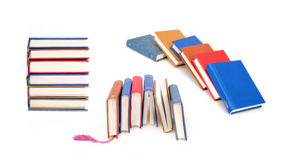 Stack of books in colour covers with white sheets isolated on a white background