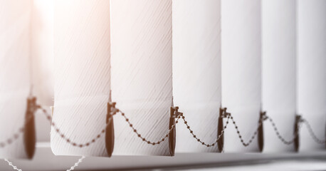 Texture of white paper venetian roller blind hanging on office window