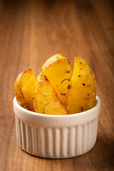 Roasted potatoes with rosemary on the plate.