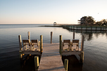 Fototapeta premium Chairs on the edge of the Ocean