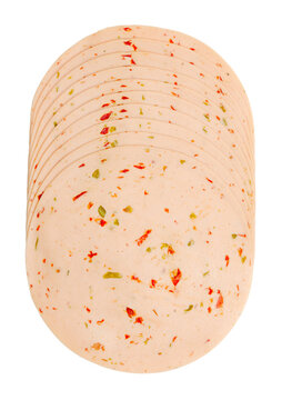 Cold cut vegetarian savory sausage, sliced and  placed on top of each other. Thin slices of spicy Extrawurst. Scalded milk protein, egg white and peas with chunks of red and green chili peppers. Photo
