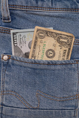 One American dollar aged bill and one hundred dollars new bill in pocket of pants.