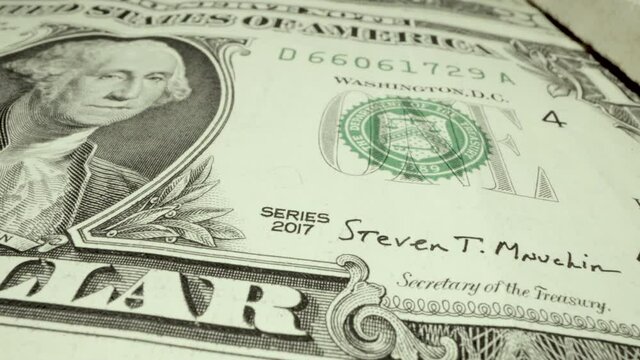 Washington, DC US - April 15, 2021: Series 2017 one dollar bill with signature of secretary of the treasury Steven T Mnuchin on the front face of the printed paper fiat currency minted in the US