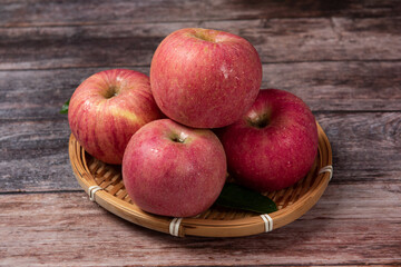 Ripe red apples on wooden table