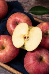 Ripe red apples on wooden table