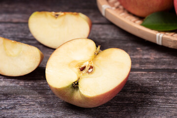 Ripe red apples on wooden table