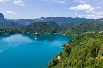 View over the cristal blue Bled lake during sunny summer day in Slovenian mountains. 