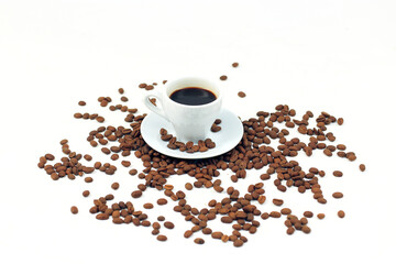 Ceramic coffee cup, many coffee beans isolated on white background