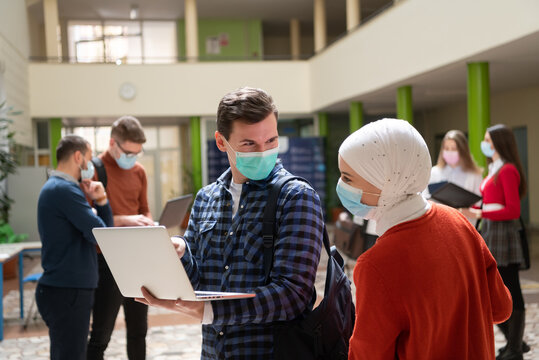 Portrait of multiethnic students group at university wearing protective face mask