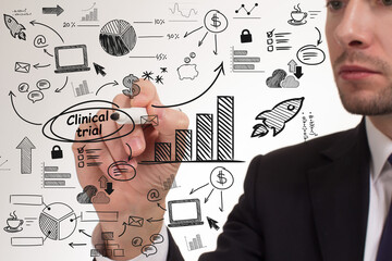 Business, technology, internet and network concept. Young businessman thinks over the steps for successful growth: Clinical trial