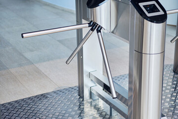 Iron bars of the turnstile for the passage of visitors
