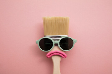 Paint brush diy character with sunglasses and sad face