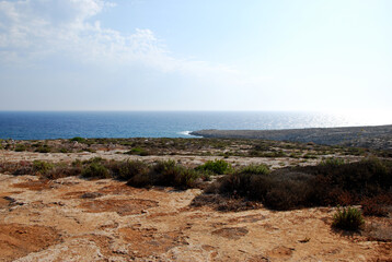 Fototapeta na wymiar Land, sea, sky. Panorama. Lampedusa, summer 2009.
